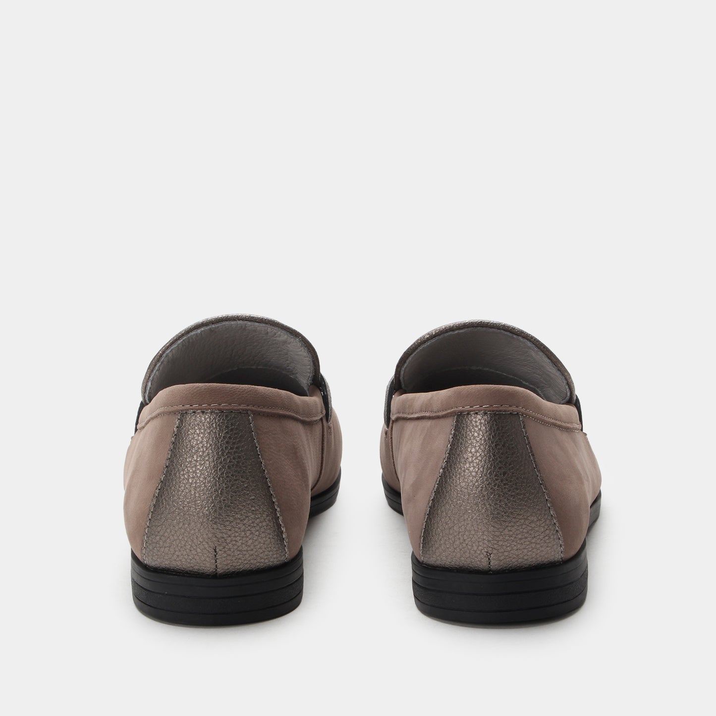 Pair of brown slip-on shoes on a white background