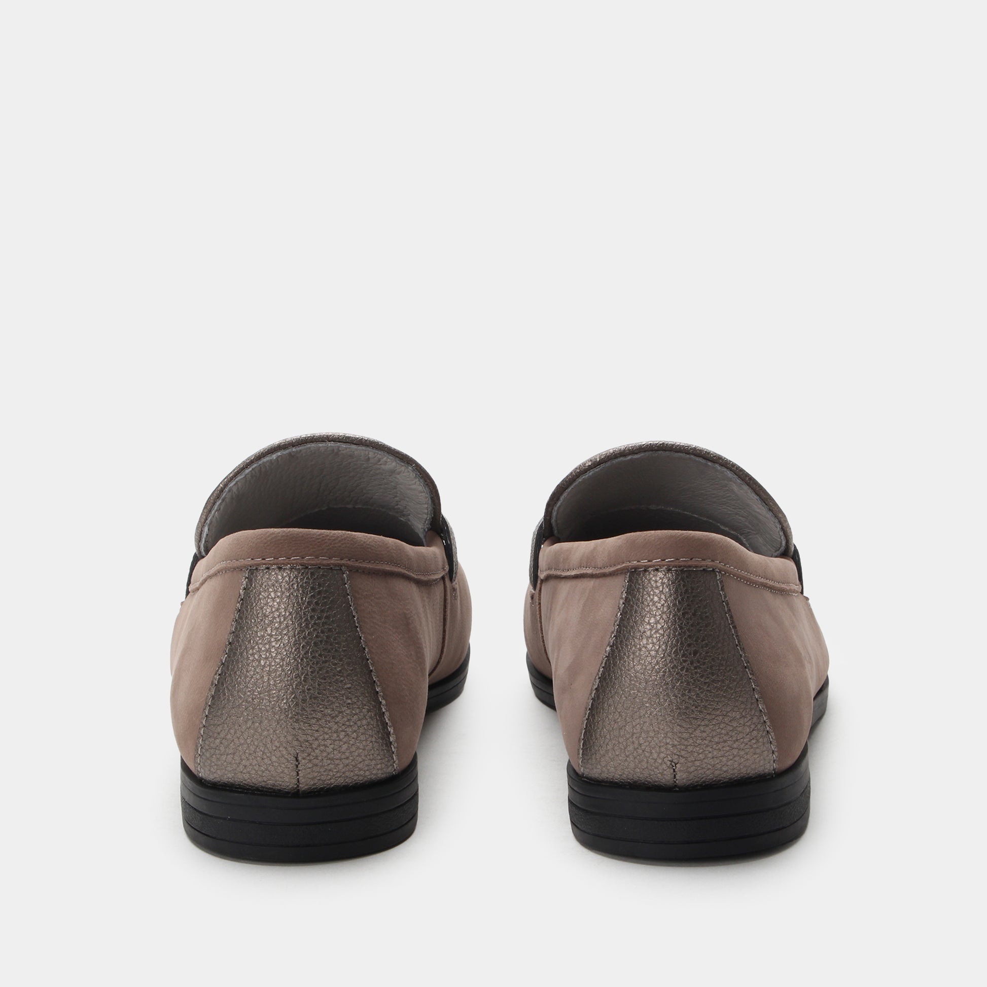 Pair of brown slip-on shoes on a white background