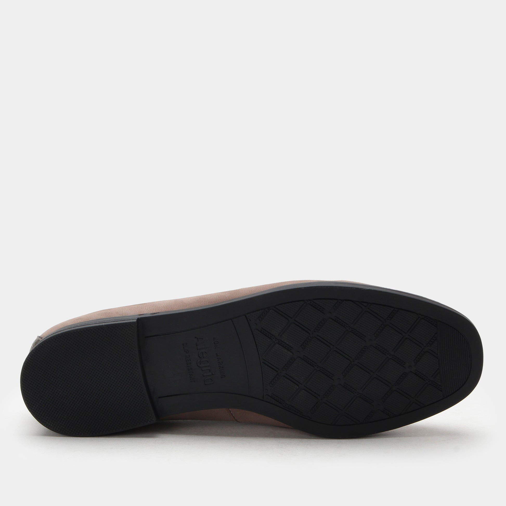 Brown shoe sole with a textured pattern on a white background