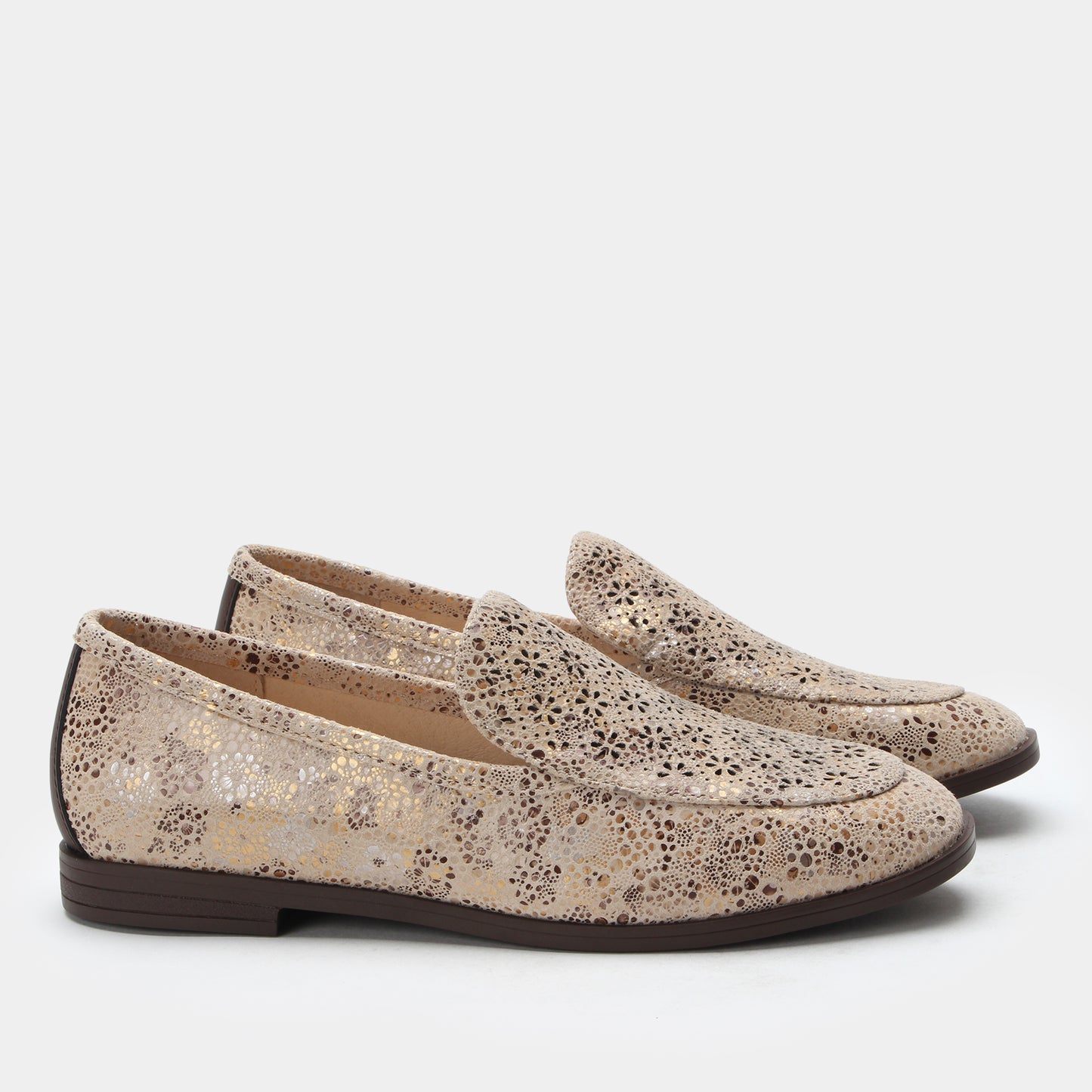 Pair of glittery loafers on a white background