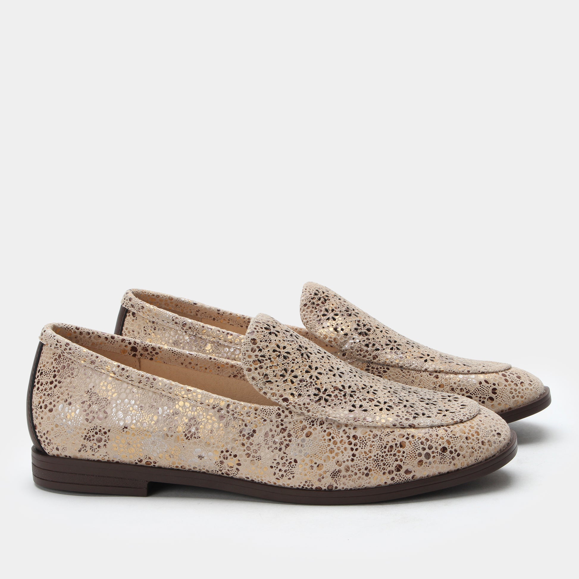 Pair of glittery loafers on a white background