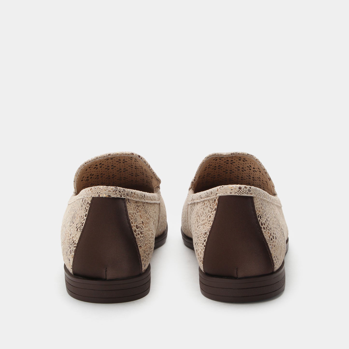 Pair of brown and beige shoes on a white background