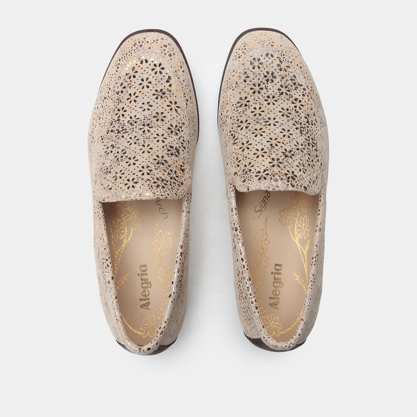 Pair of speckled loafers on a white background