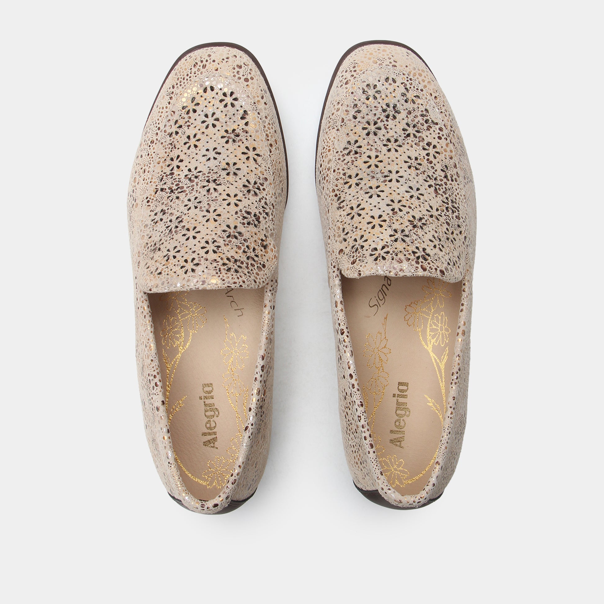 Pair of speckled loafers on a white background