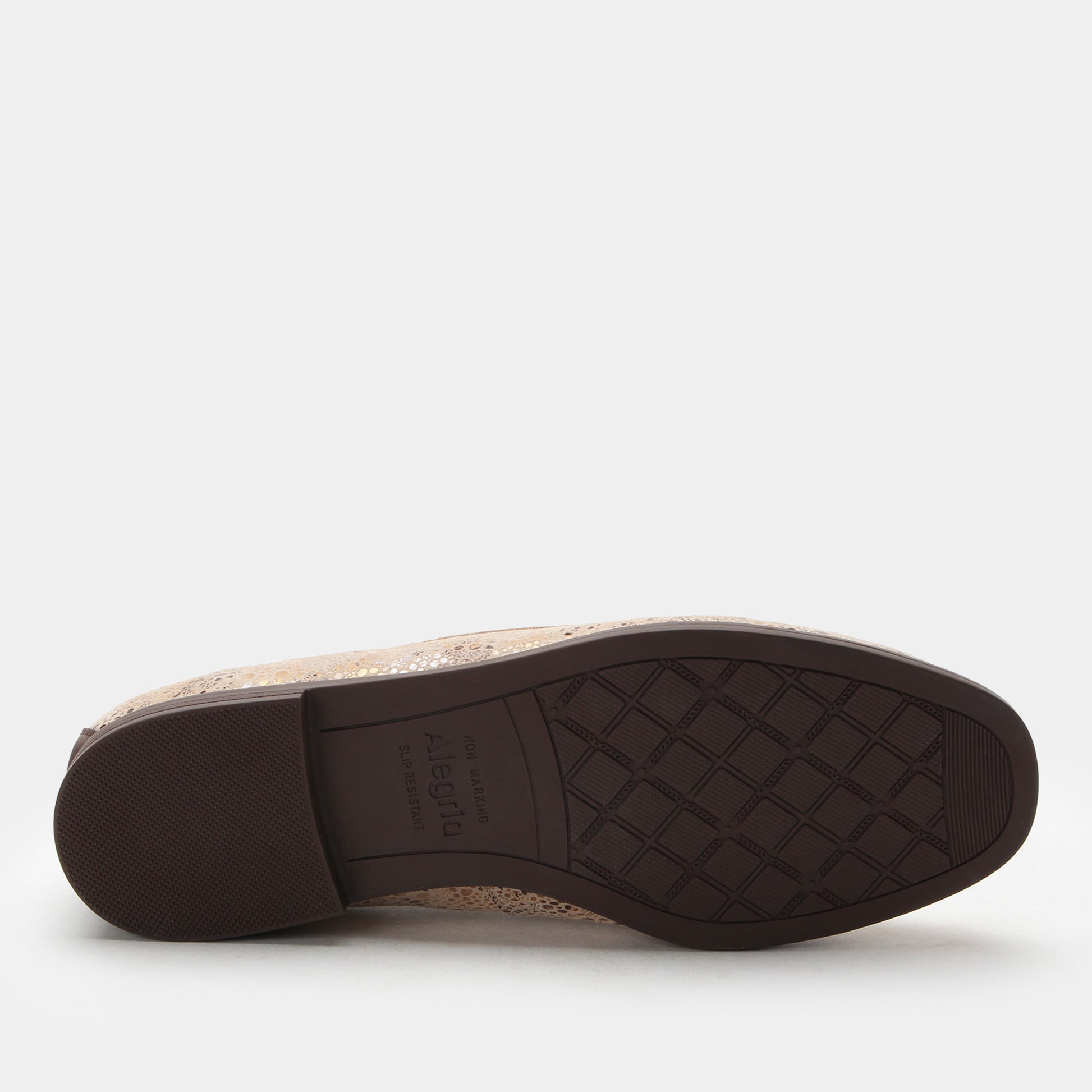 Close-up of a shoe sole with brand name on a white background