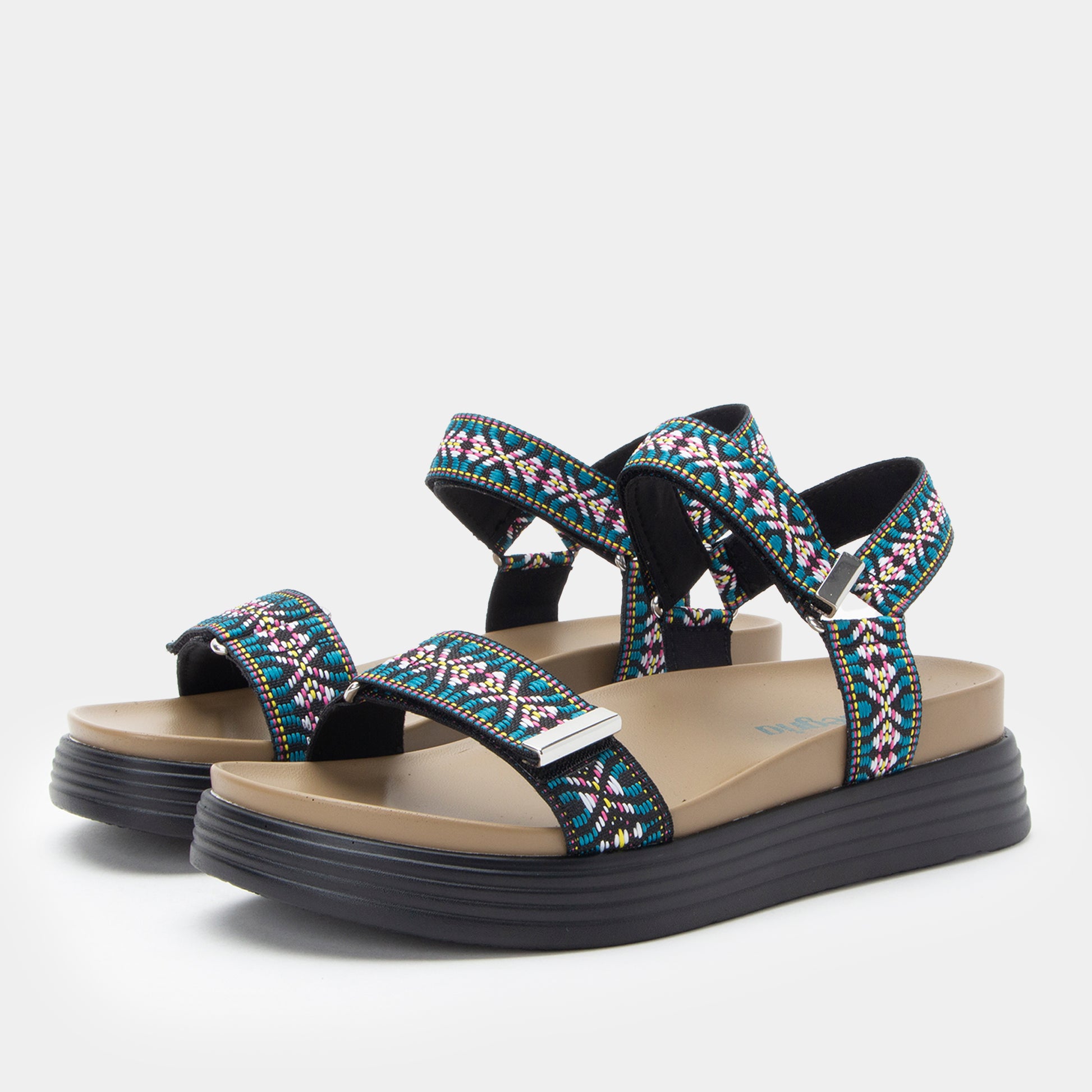 Pair of sandals with colorful strap design on a light gray background