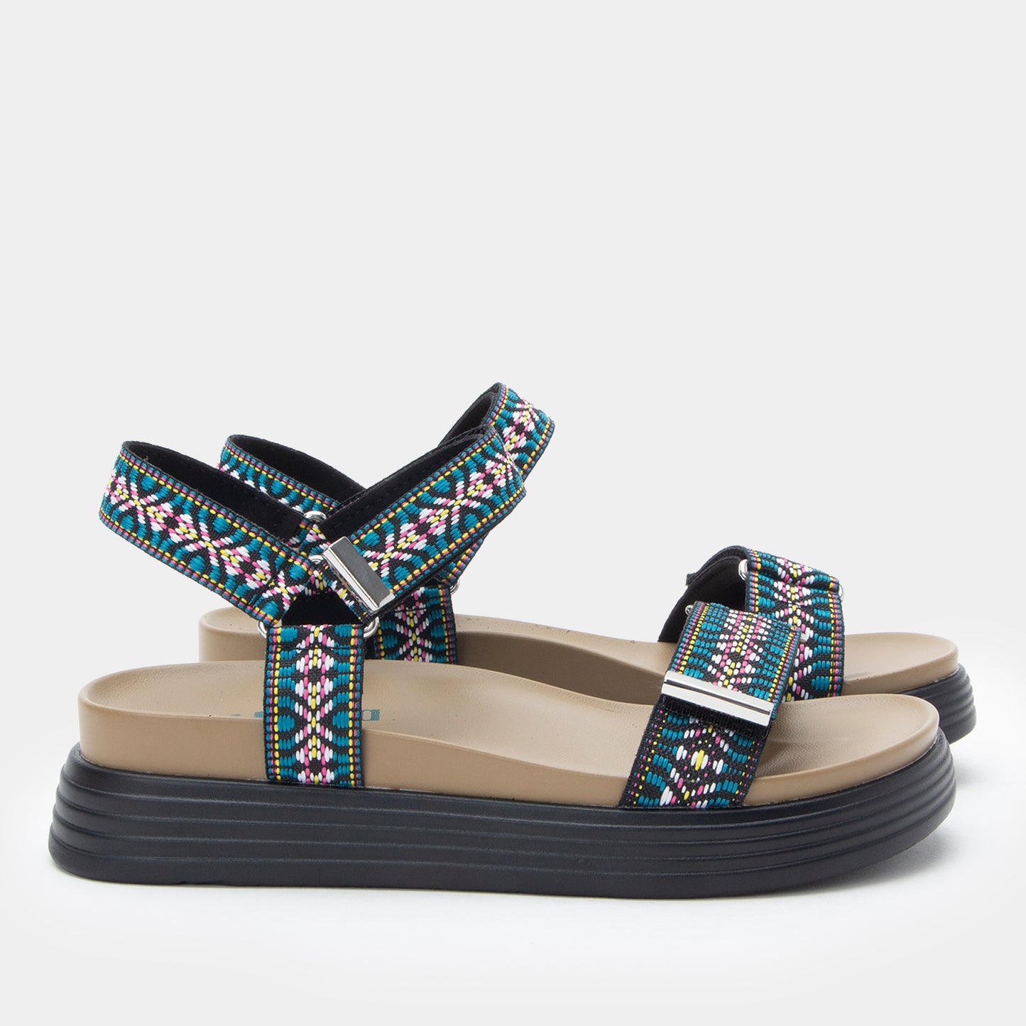 Pair of sandals with colorful straps on a light gray background