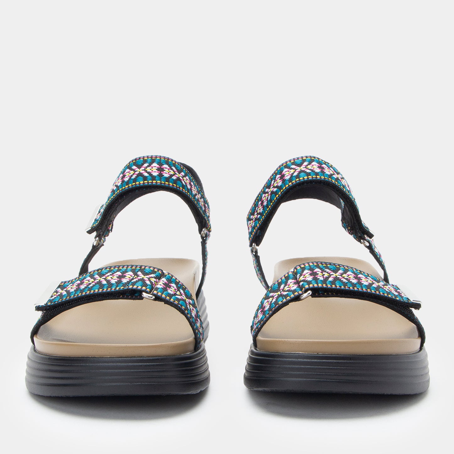 Pair of sandals with colorful straps on a white background