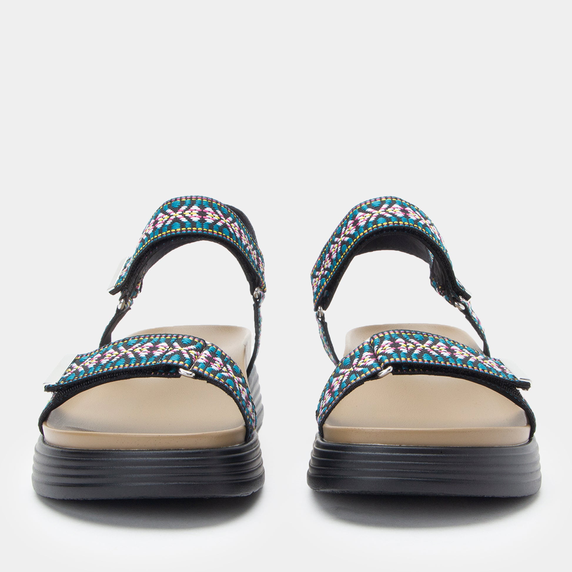 Pair of sandals with colorful straps on a white background