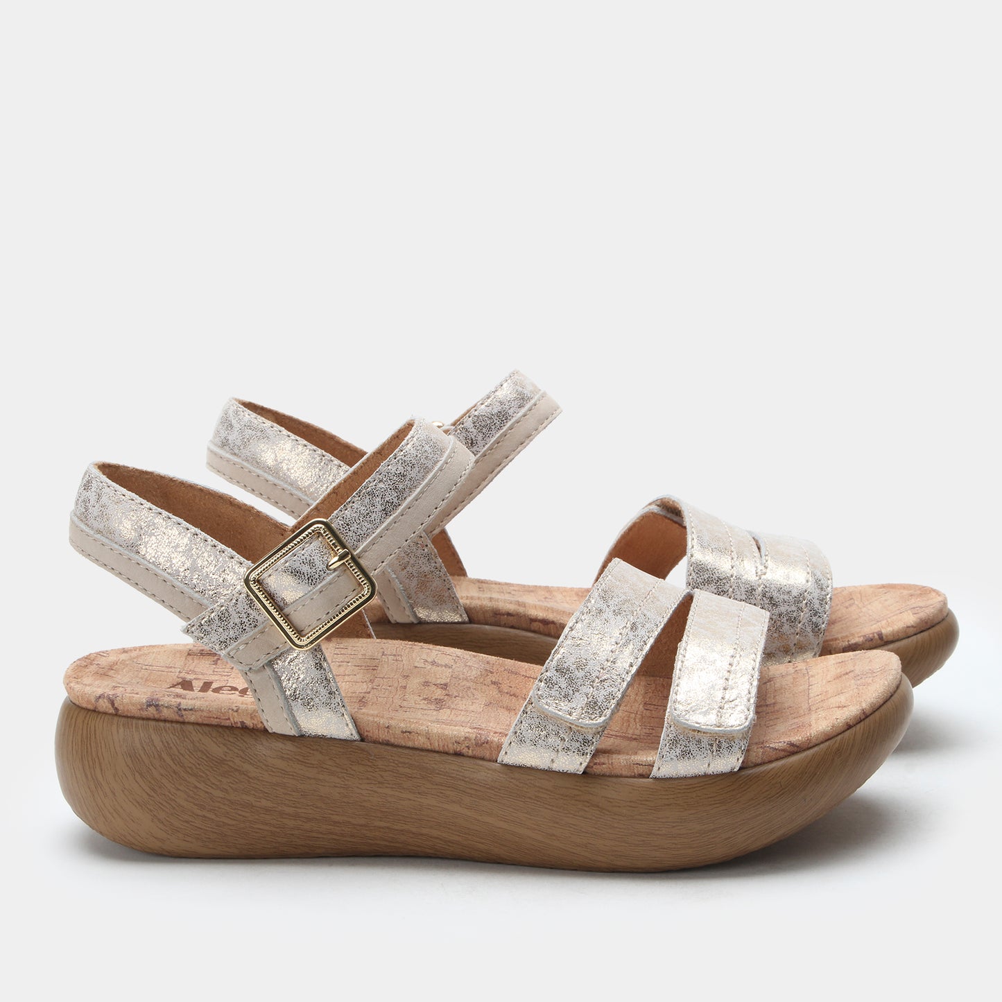 Silver strappy sandal with wooden sole on a white background