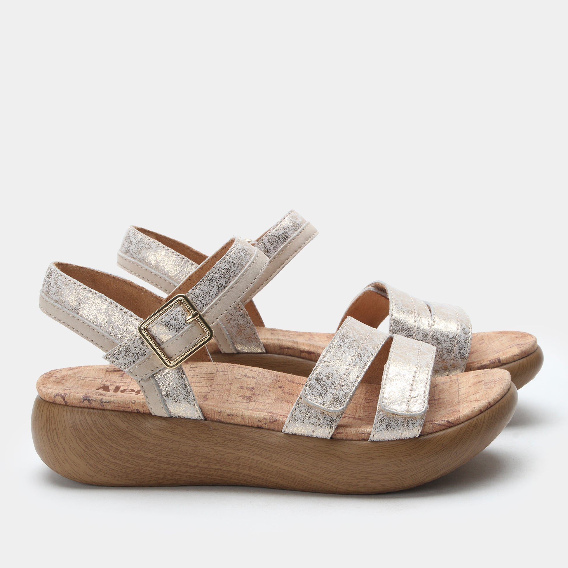 Silver strappy sandal with wooden sole on a white background