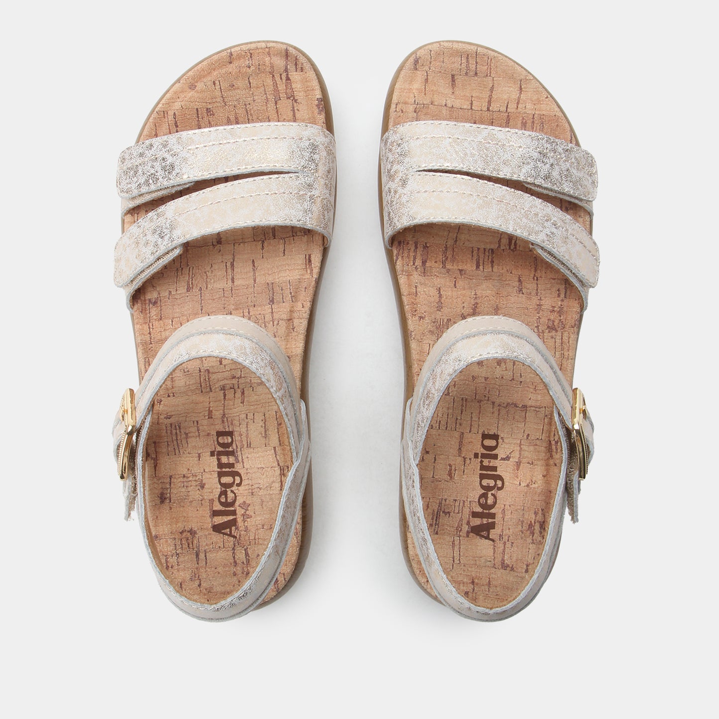 Pair of Alegria sandals with cork sole on a white background