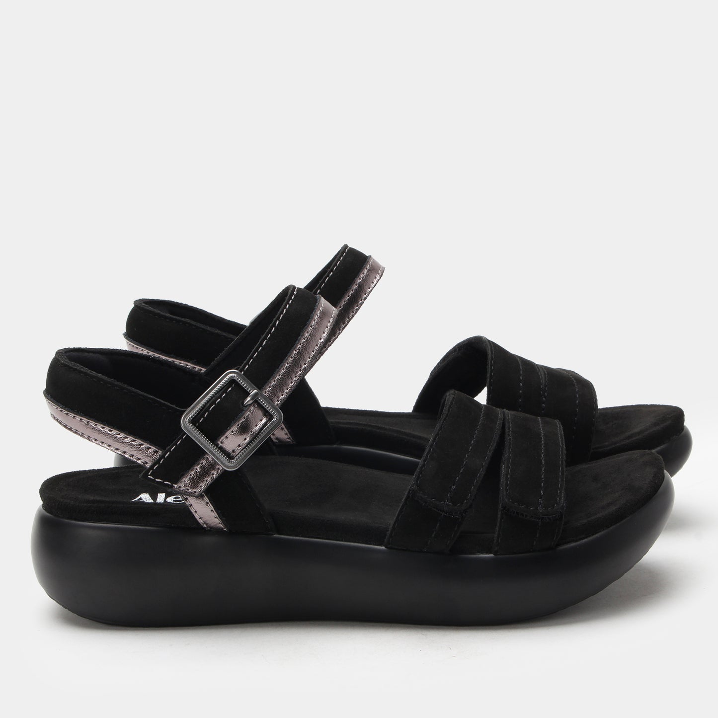 Black sandal with multiple straps on a light gray background