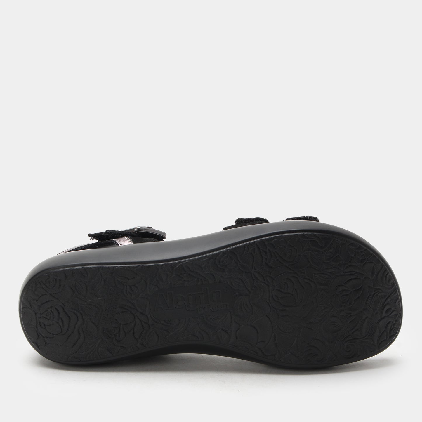 Black sandal sole with a textured pattern on a white background