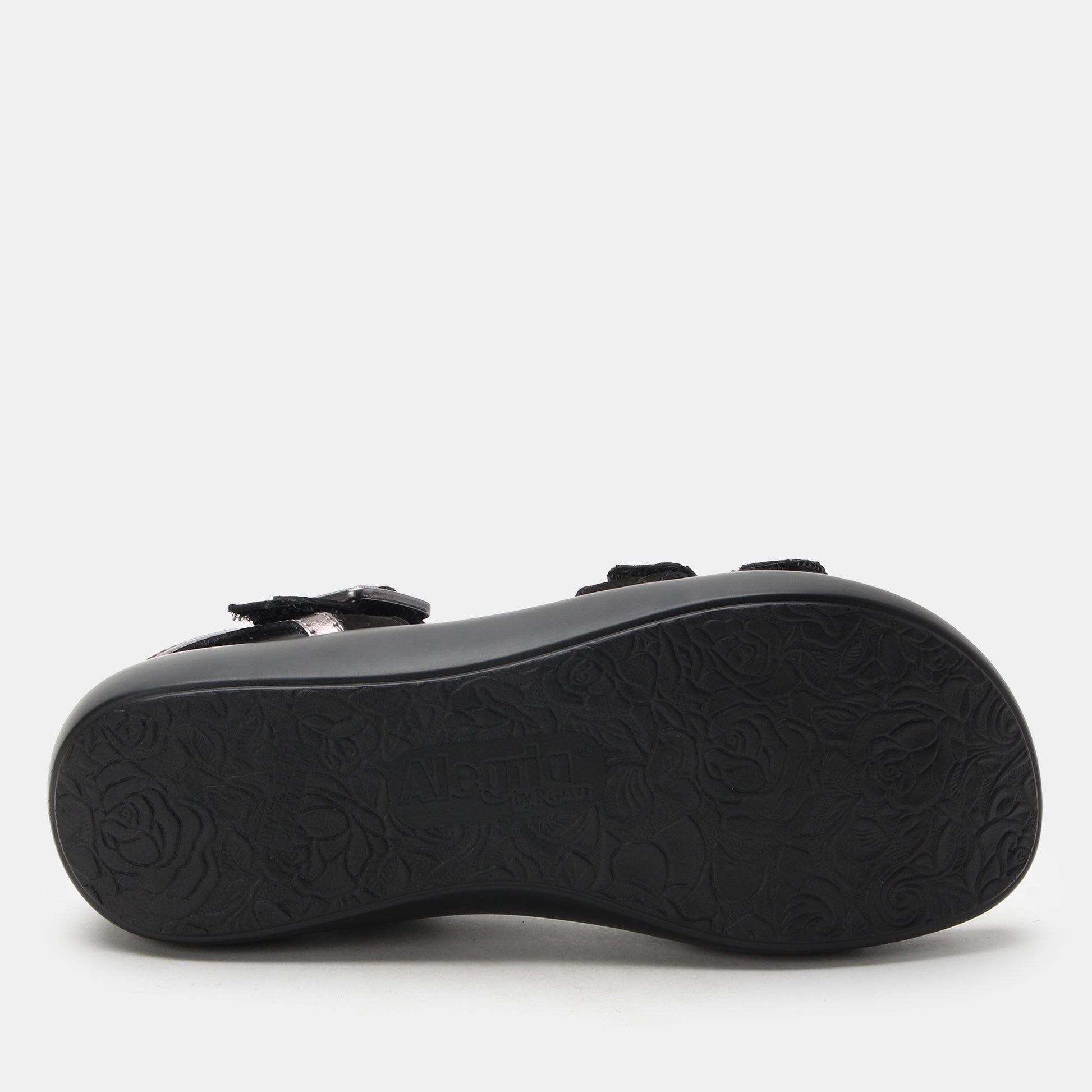 Black sandal sole with a textured pattern on a white background