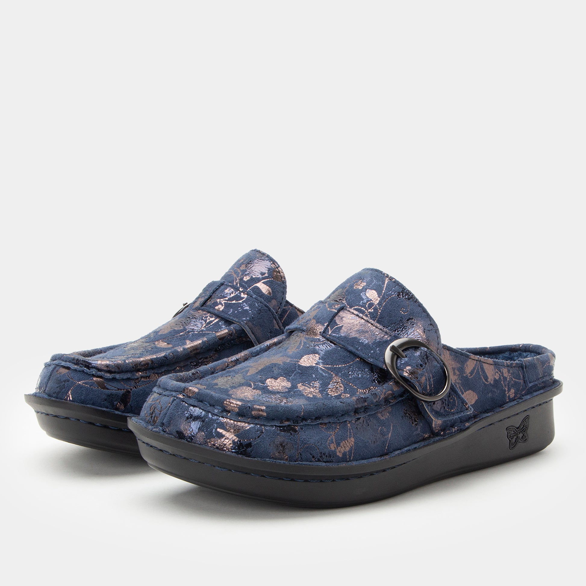 Pair of blue floral-patterned clogs on a light gray background