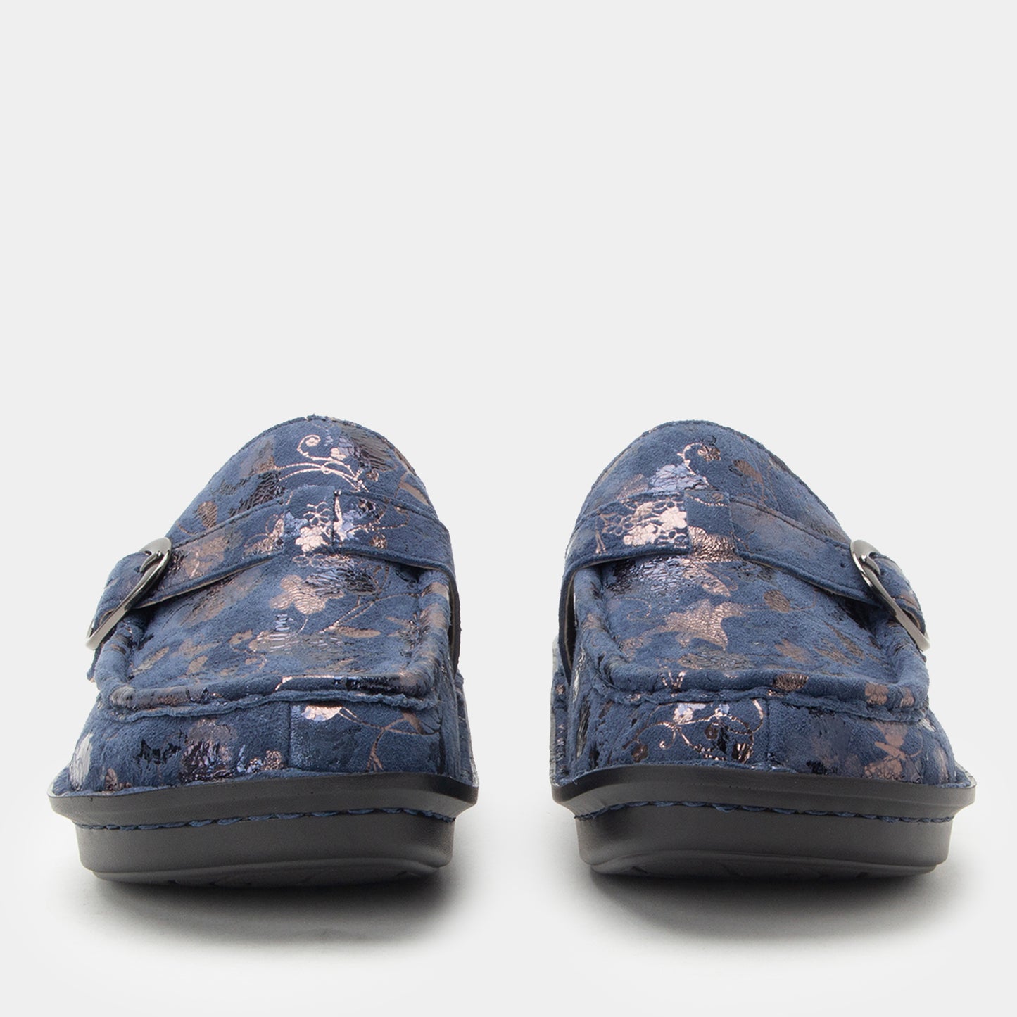 Pair of blue loafers with floral pattern on a white background