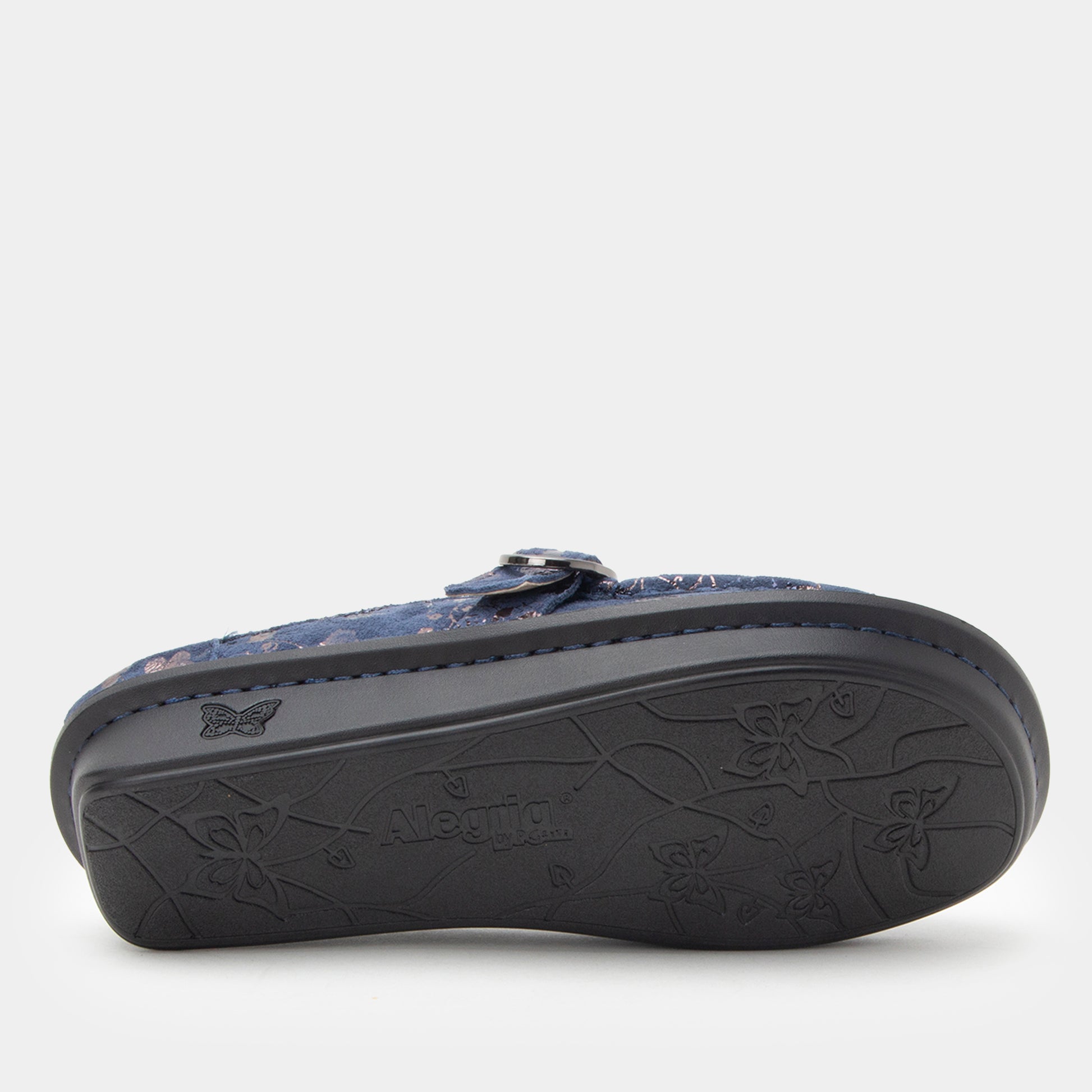 Black sandal with floral pattern on a white background