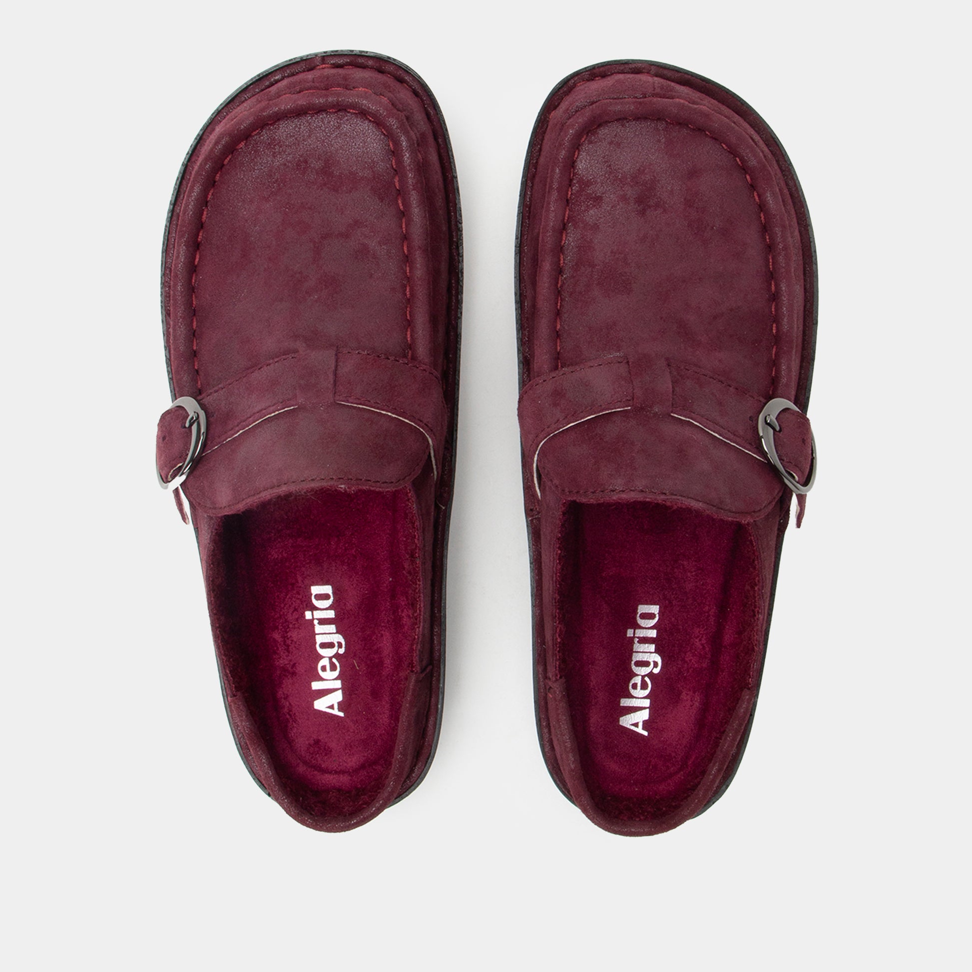 Pair of maroon loafers with 'Alegria' branding on a white background