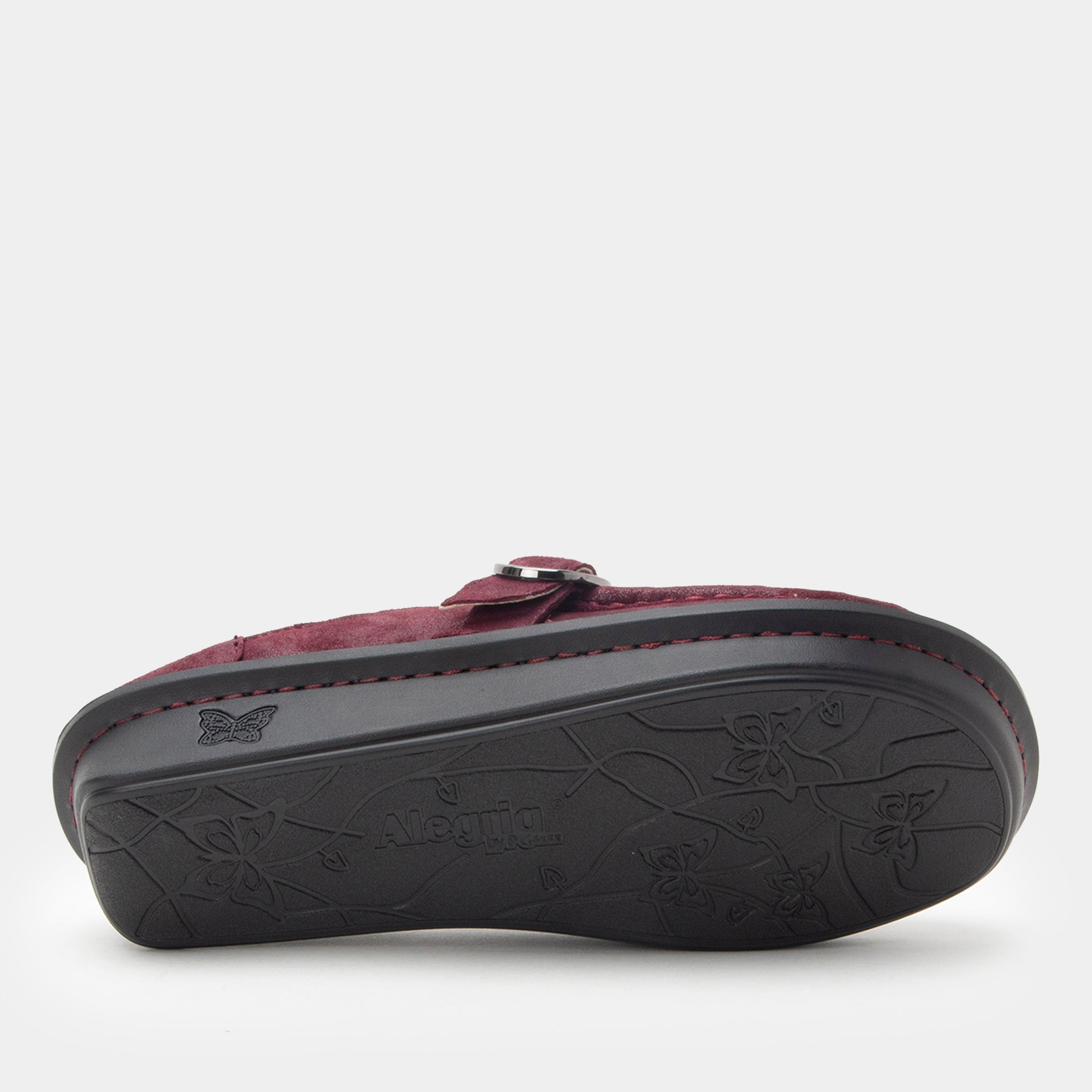 Maroon sandal with a black sole on a white background