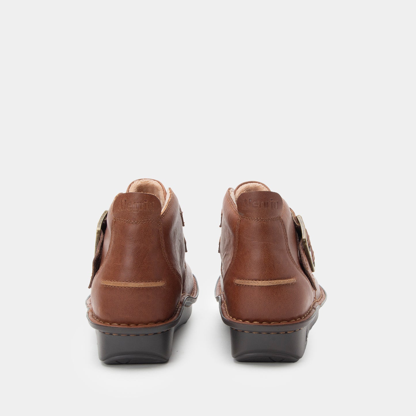 Pair of brown shoes on a white background
