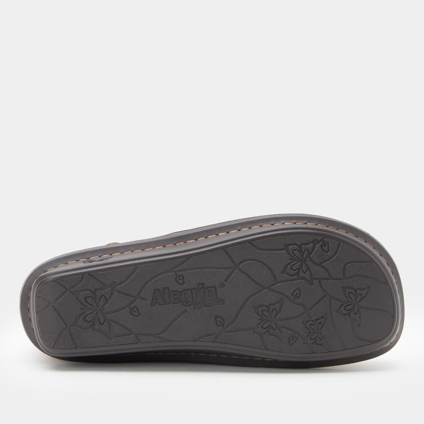 Black sandal sole with floral patterns and 'Alegria' branding on a white background