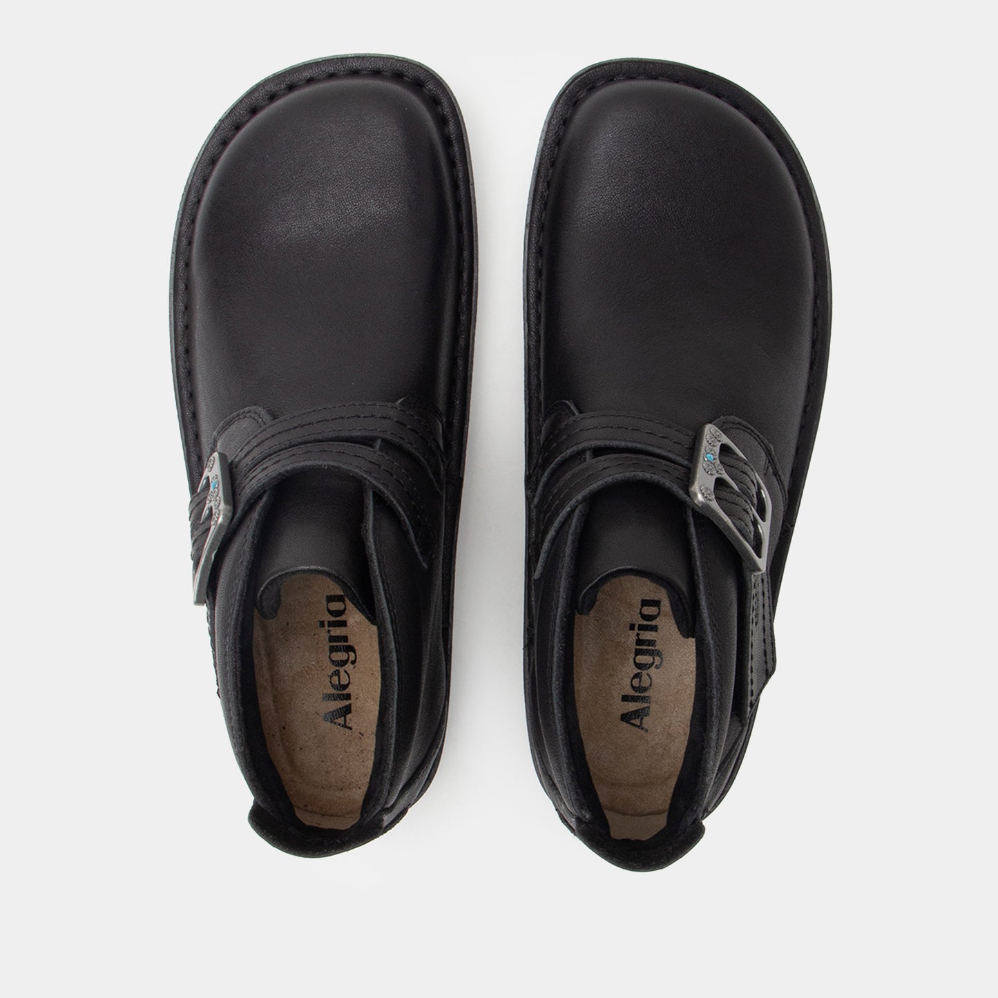Pair of black Alegria shoes on a white background
