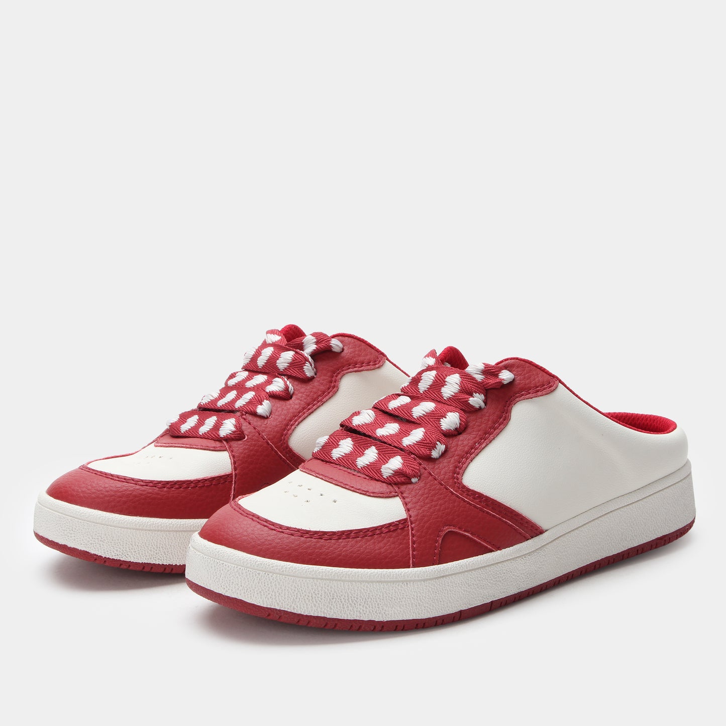 Red and white sneakers on a light gray background