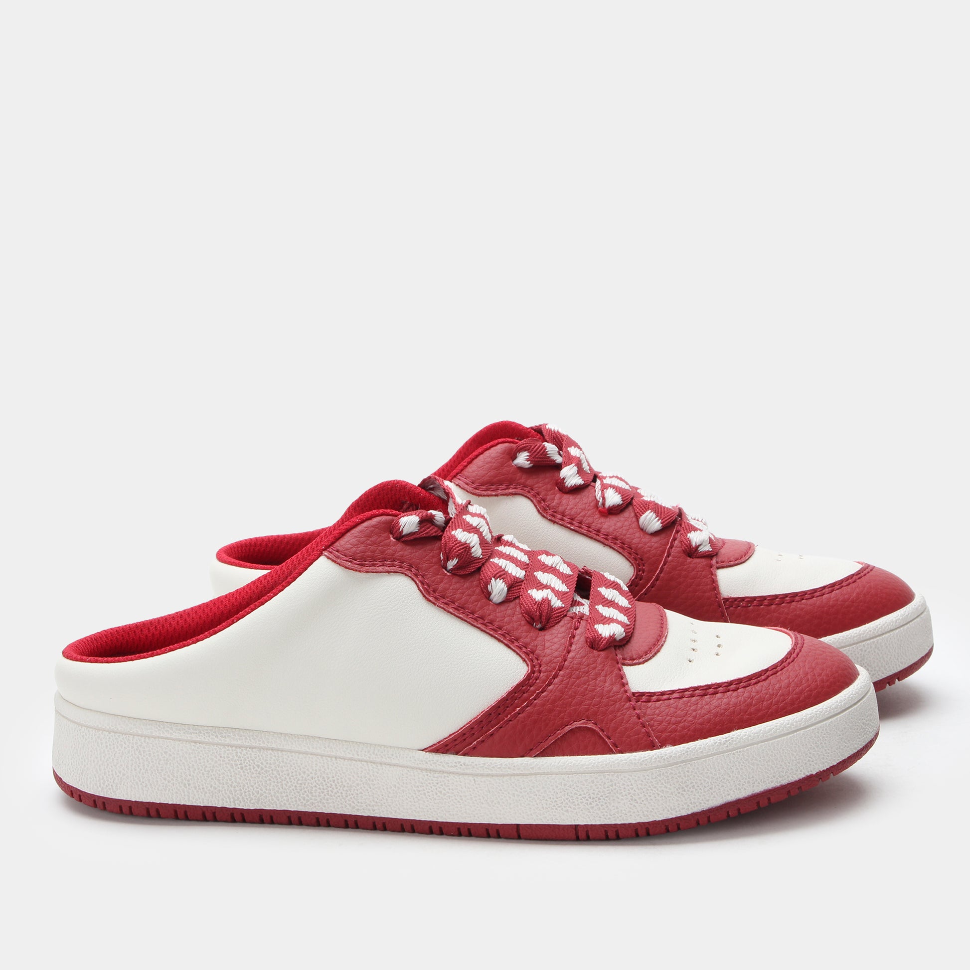 Red and white sneakers on a light gray background