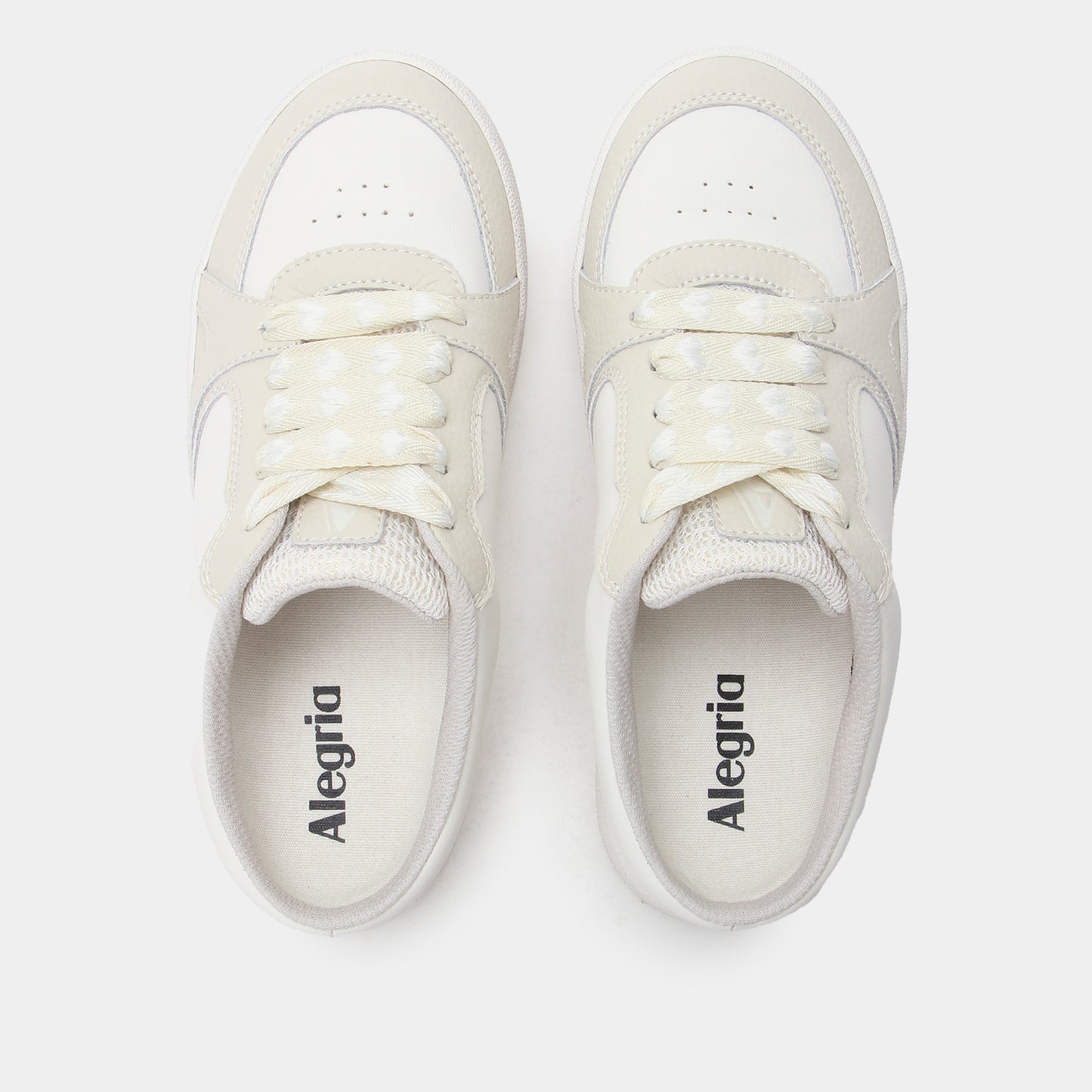 Pair of white sneakers with 'Alegria' branding on a light gray background