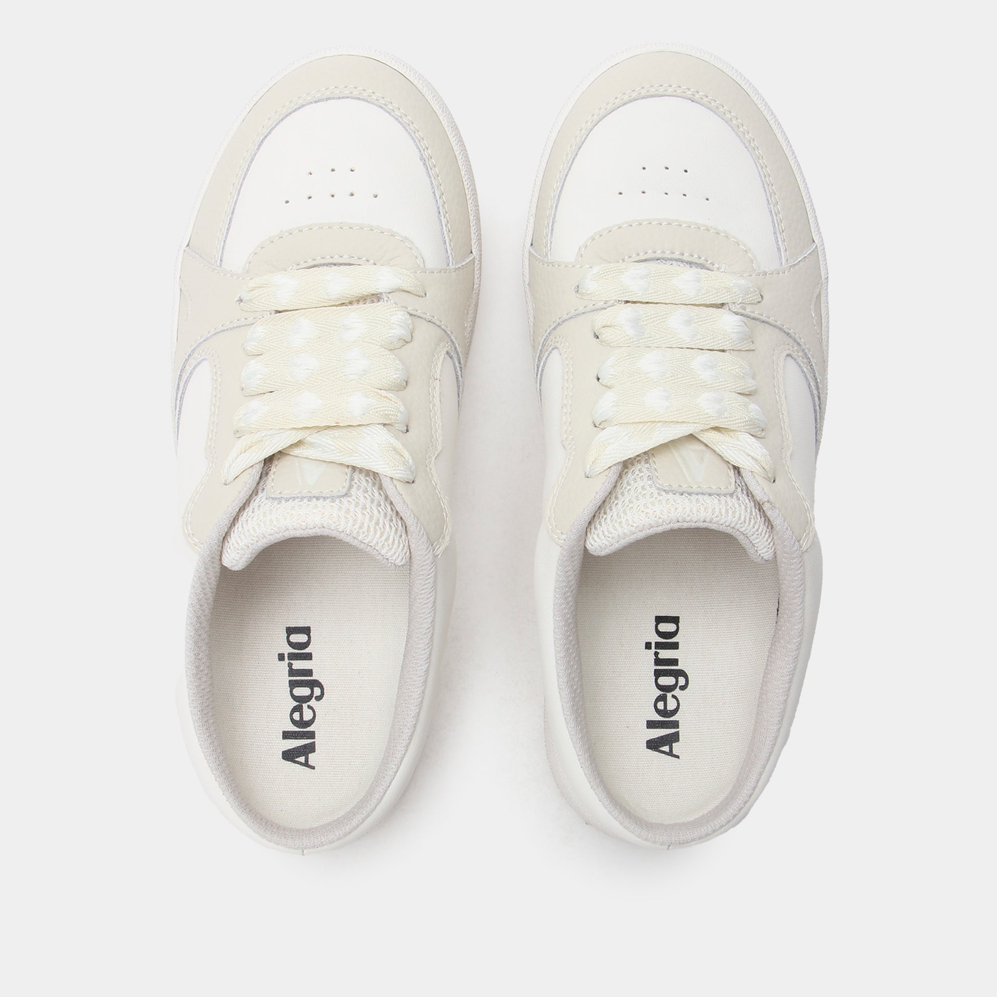 Pair of white sneakers with 'Alegria' branding on a light gray background