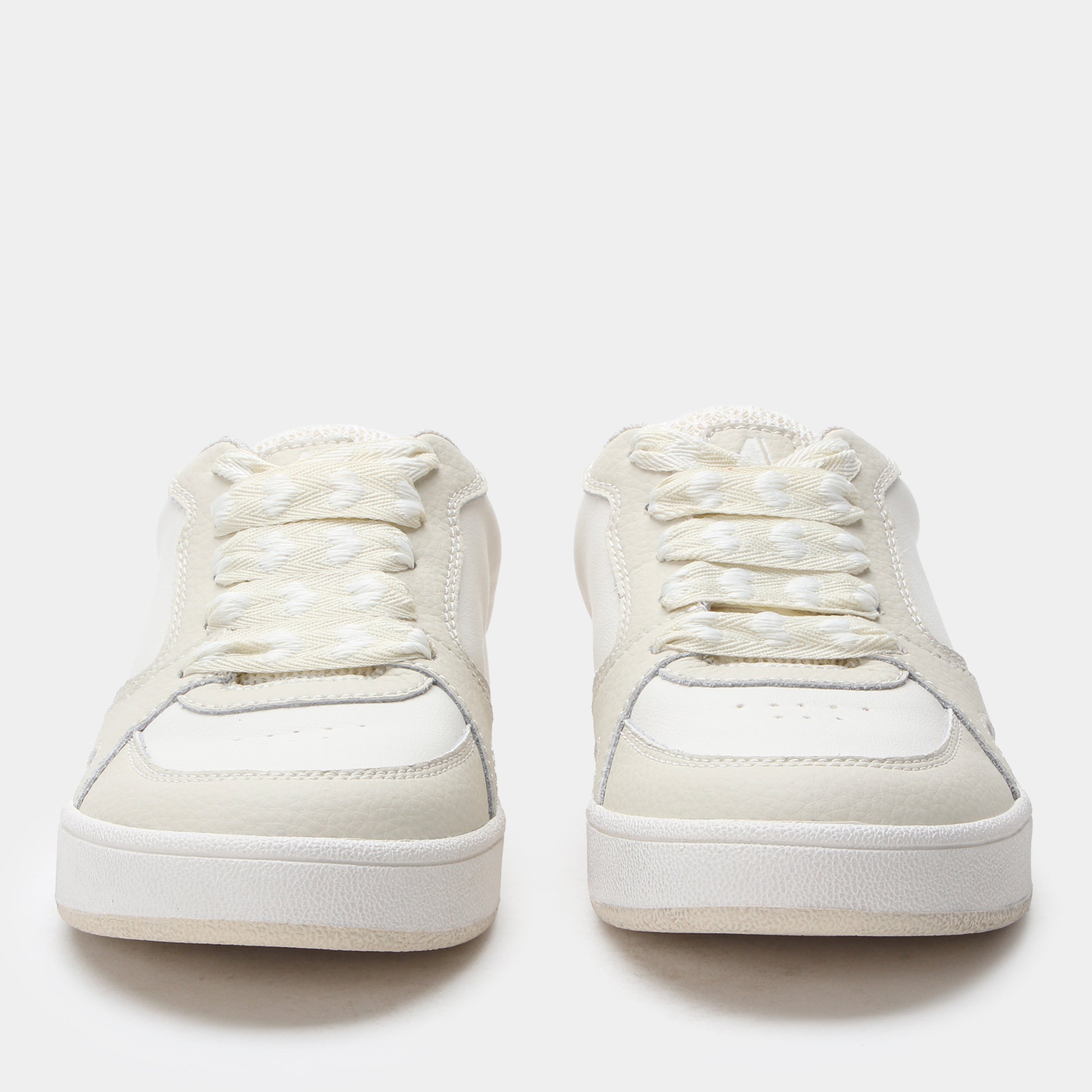 White sneakers on a white background