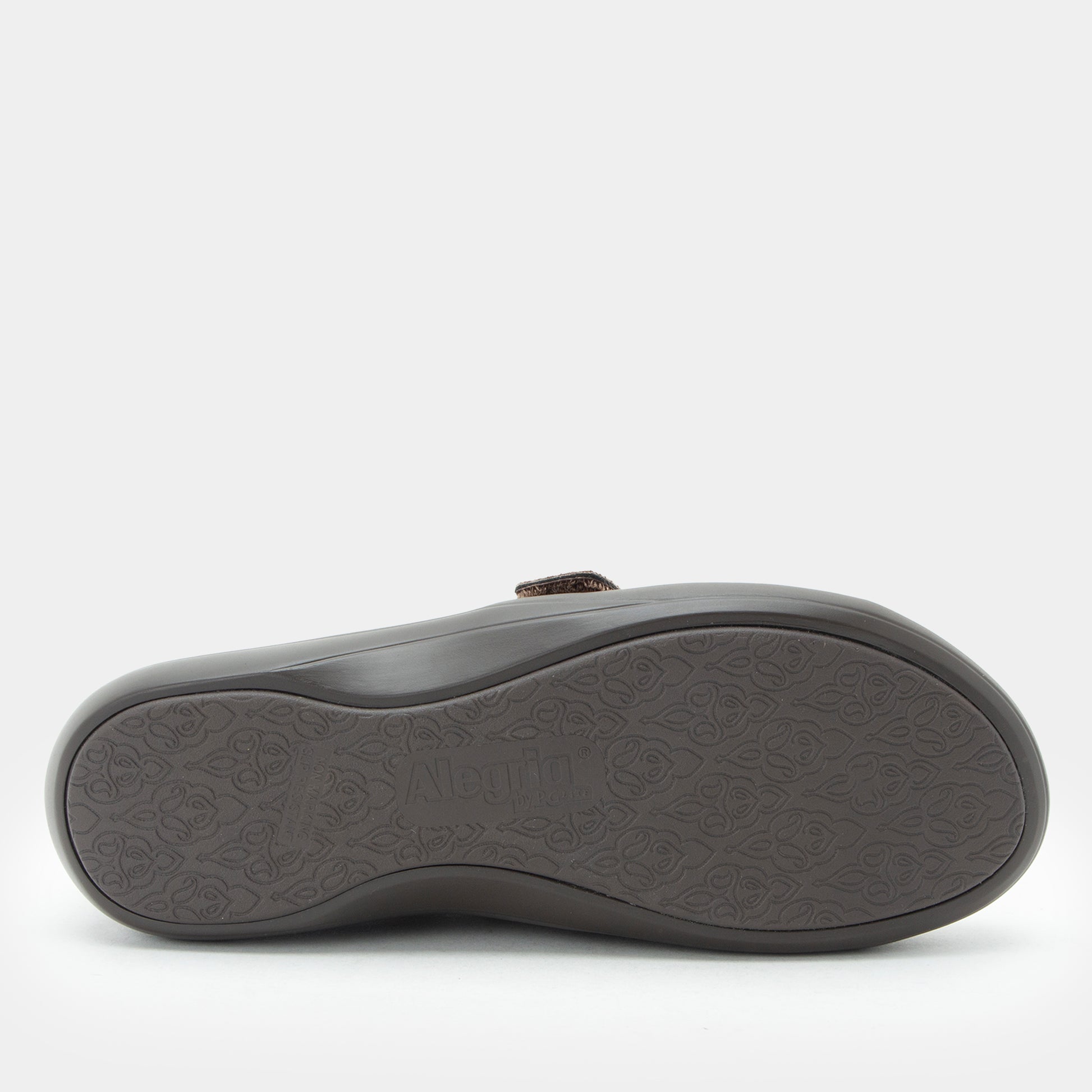 Brown slipper with sole pattern on a white background