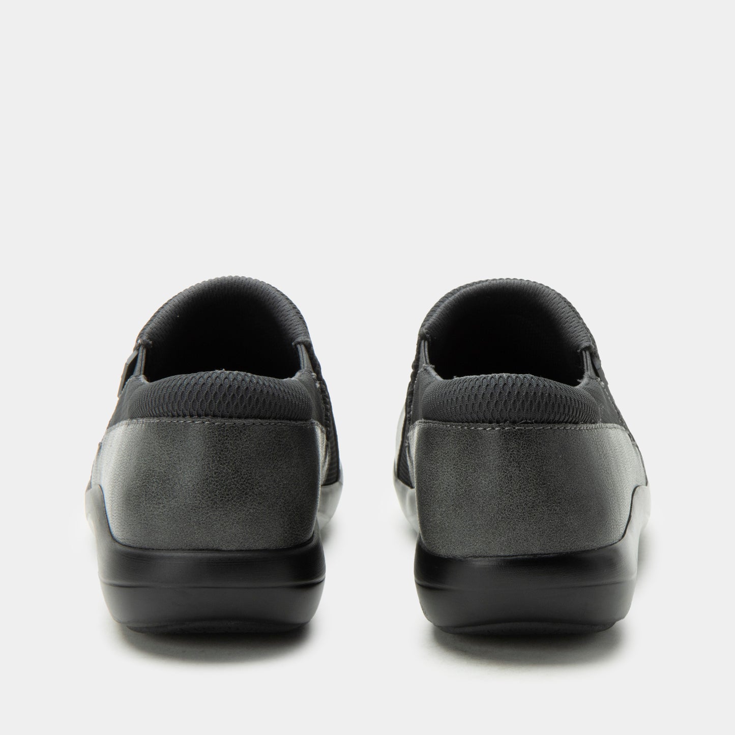 Pair of black and gray slip-on shoes on a white background