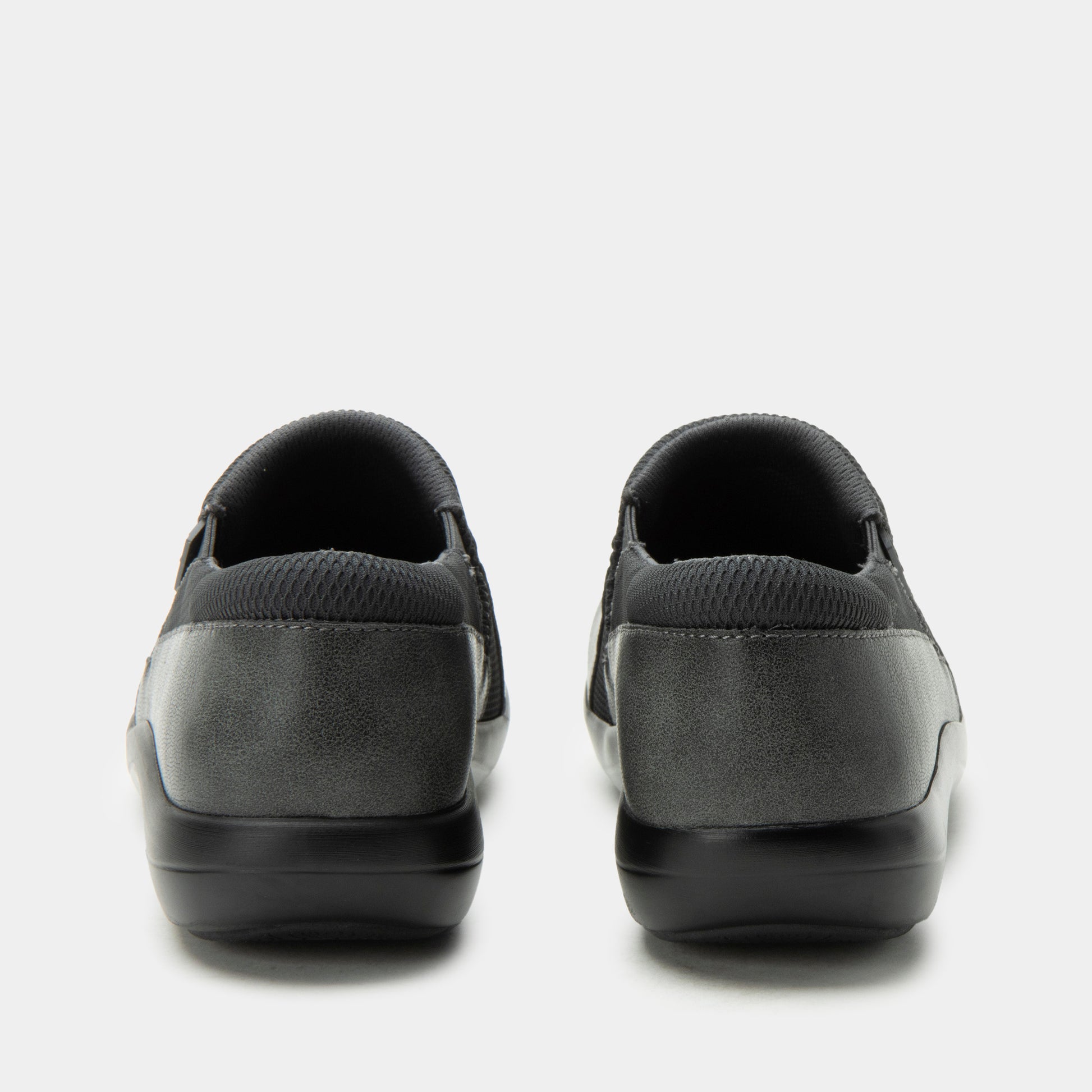 Pair of black and gray slip-on shoes on a white background