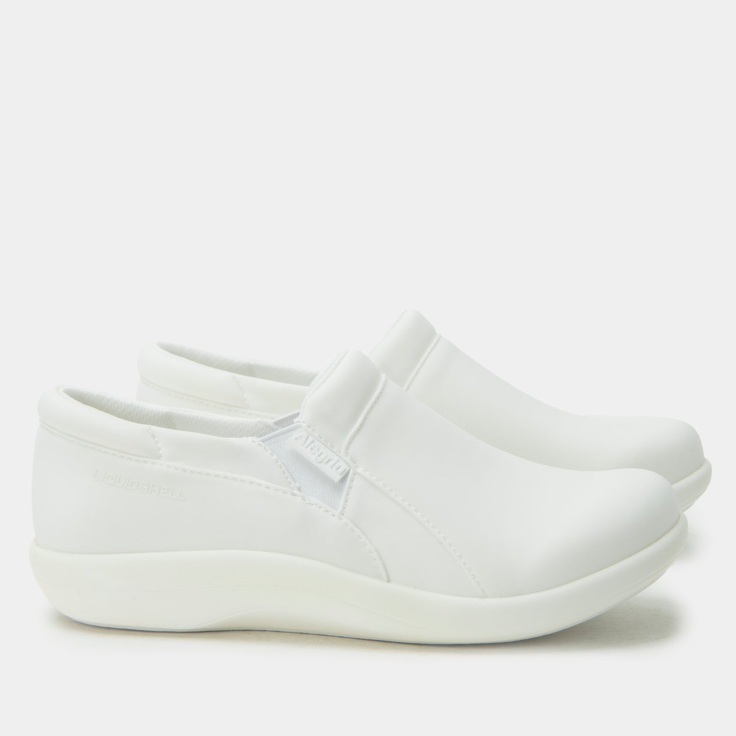 White slip-on shoe on a light gray background