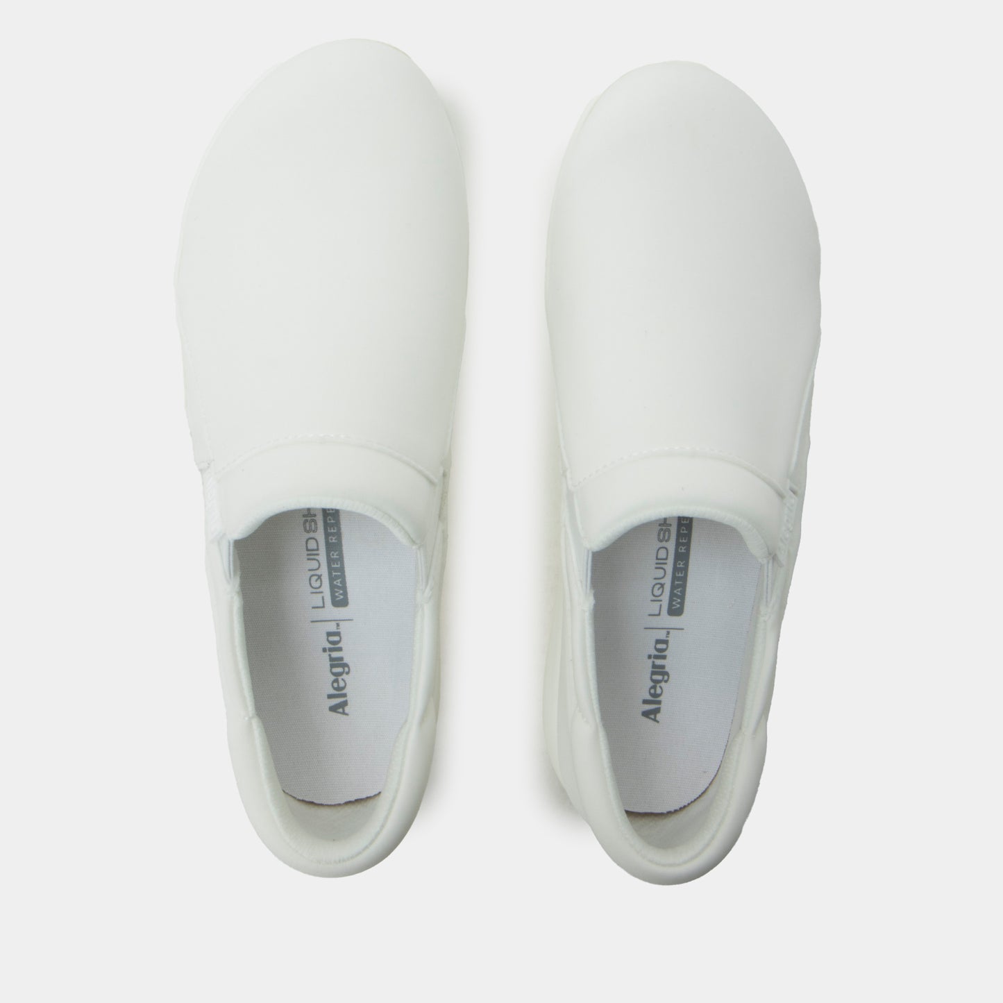 Pair of white slip-on shoes with 'Alegria' branding on a light gray background