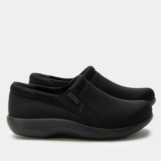Pair of black slip-on shoes on a light gray background