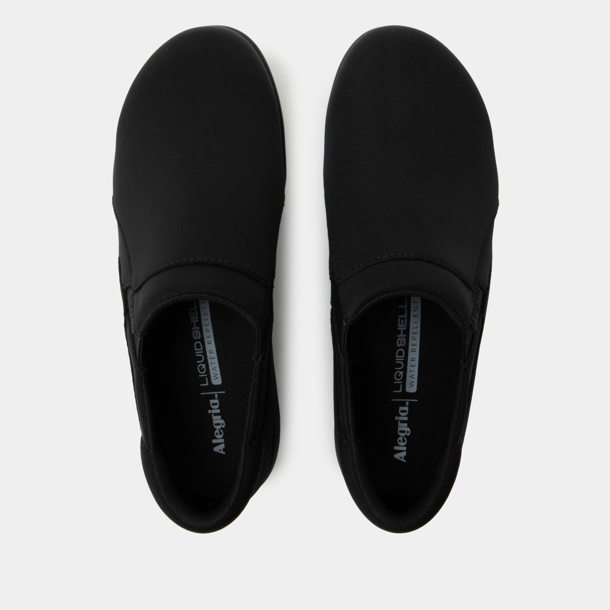 Pair of black slip-on shoes with 'Alegria' branding on a white background