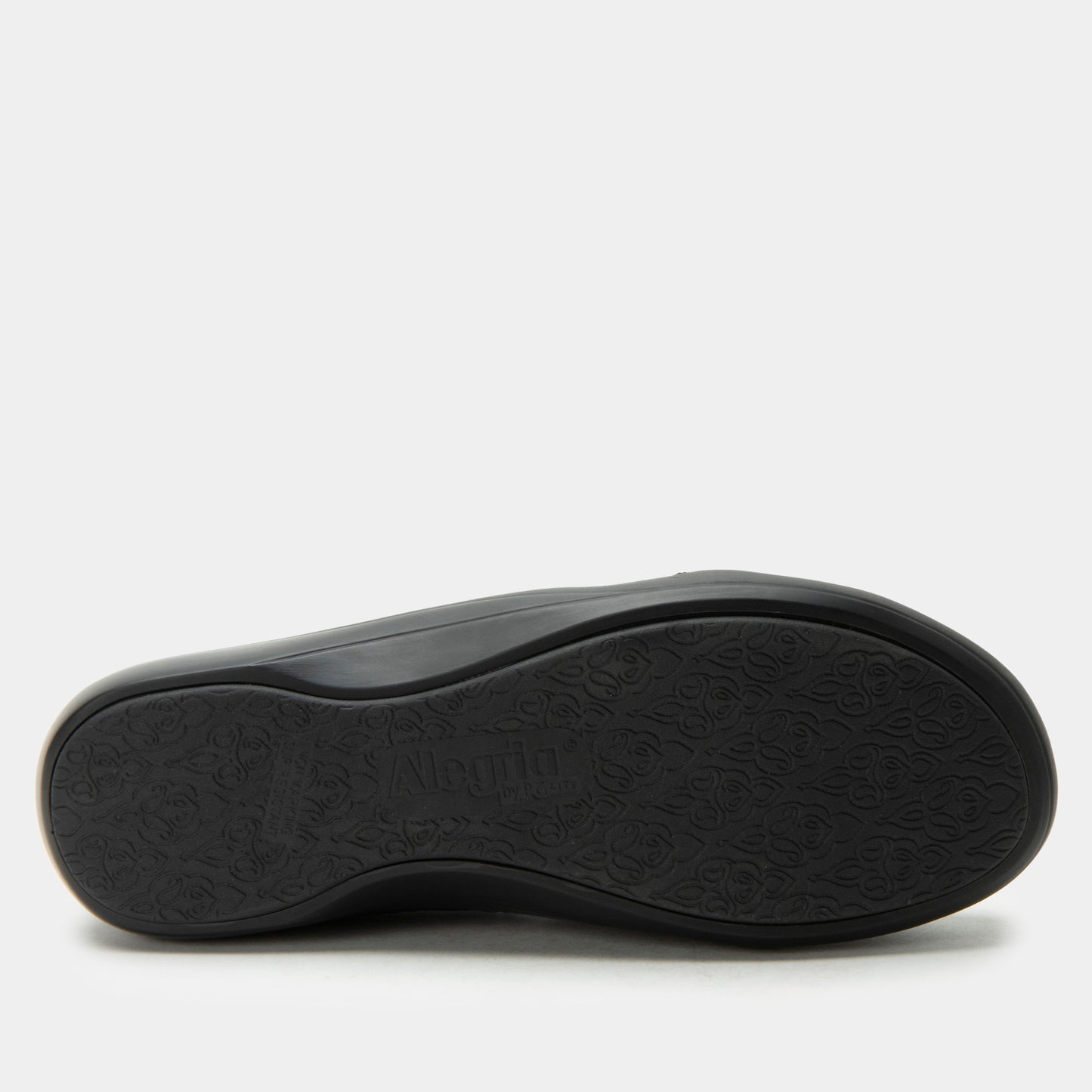 Black shoe sole on a light gray background