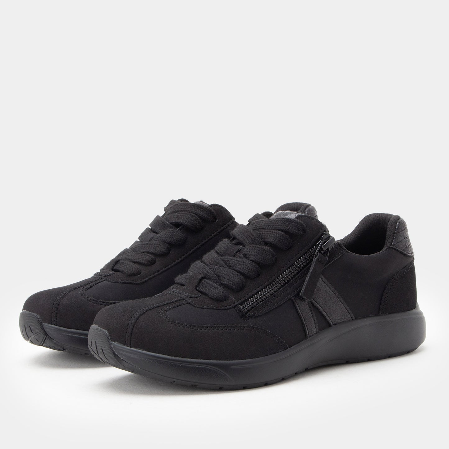 Black sneakers with a zipper on a white background