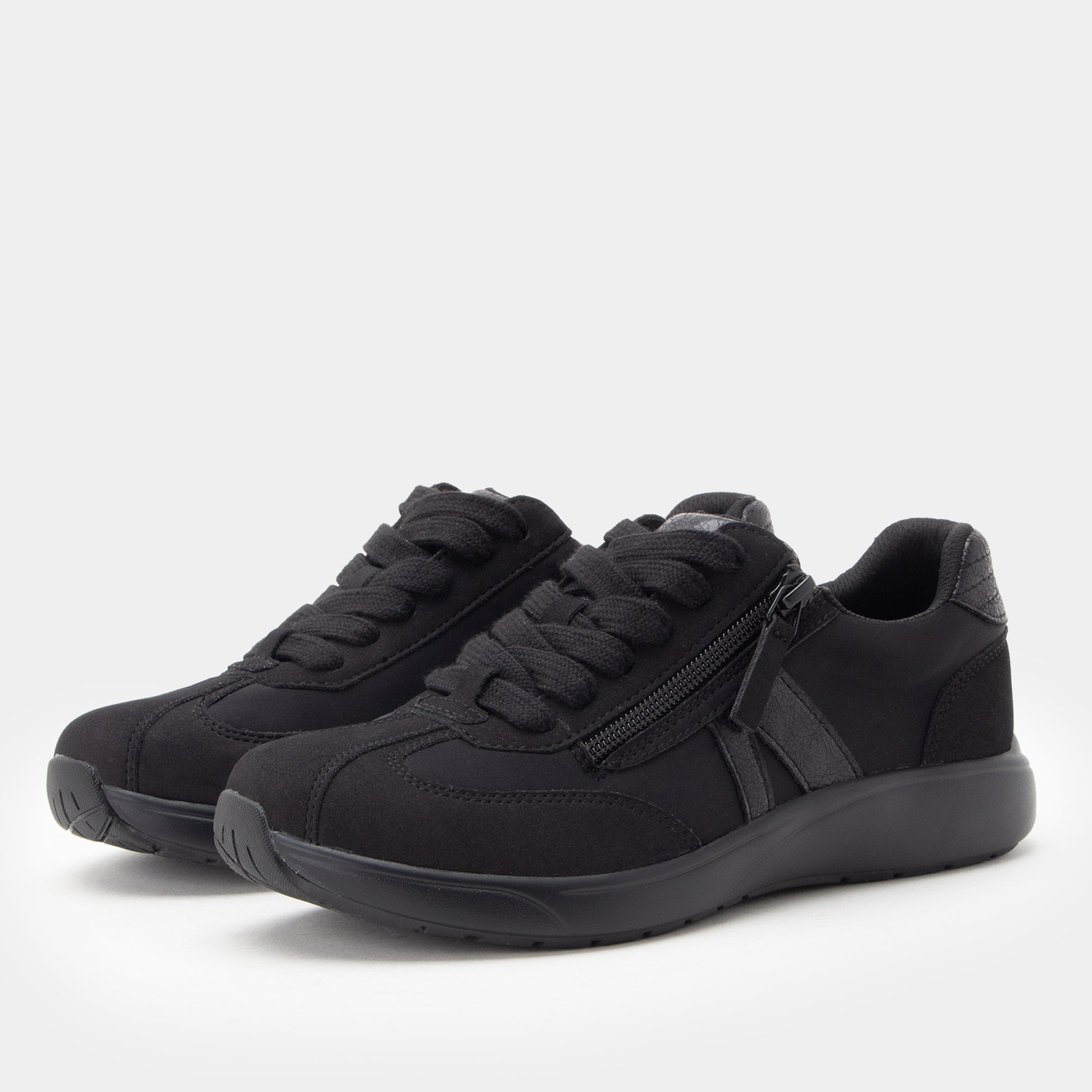 Black sneakers with a zipper on a white background