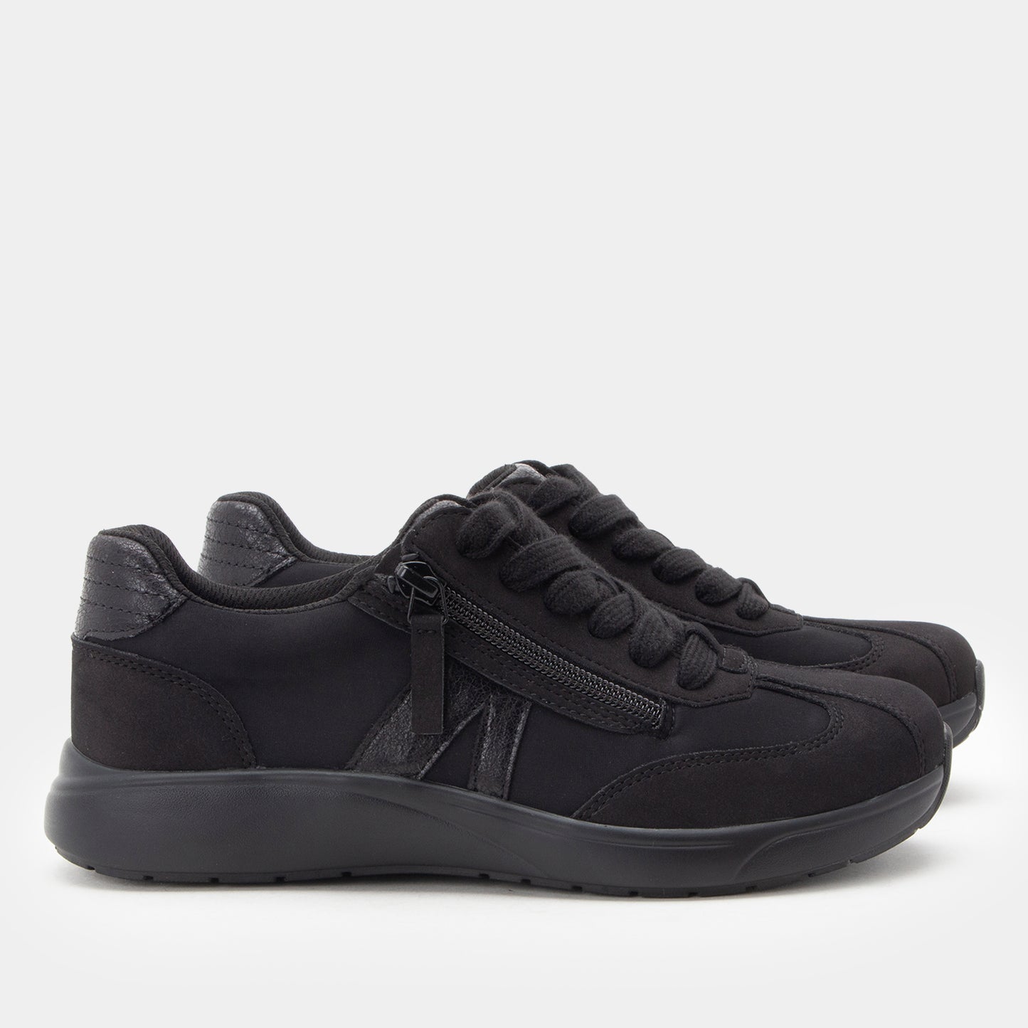 Black sneakers with a zipper on a white background