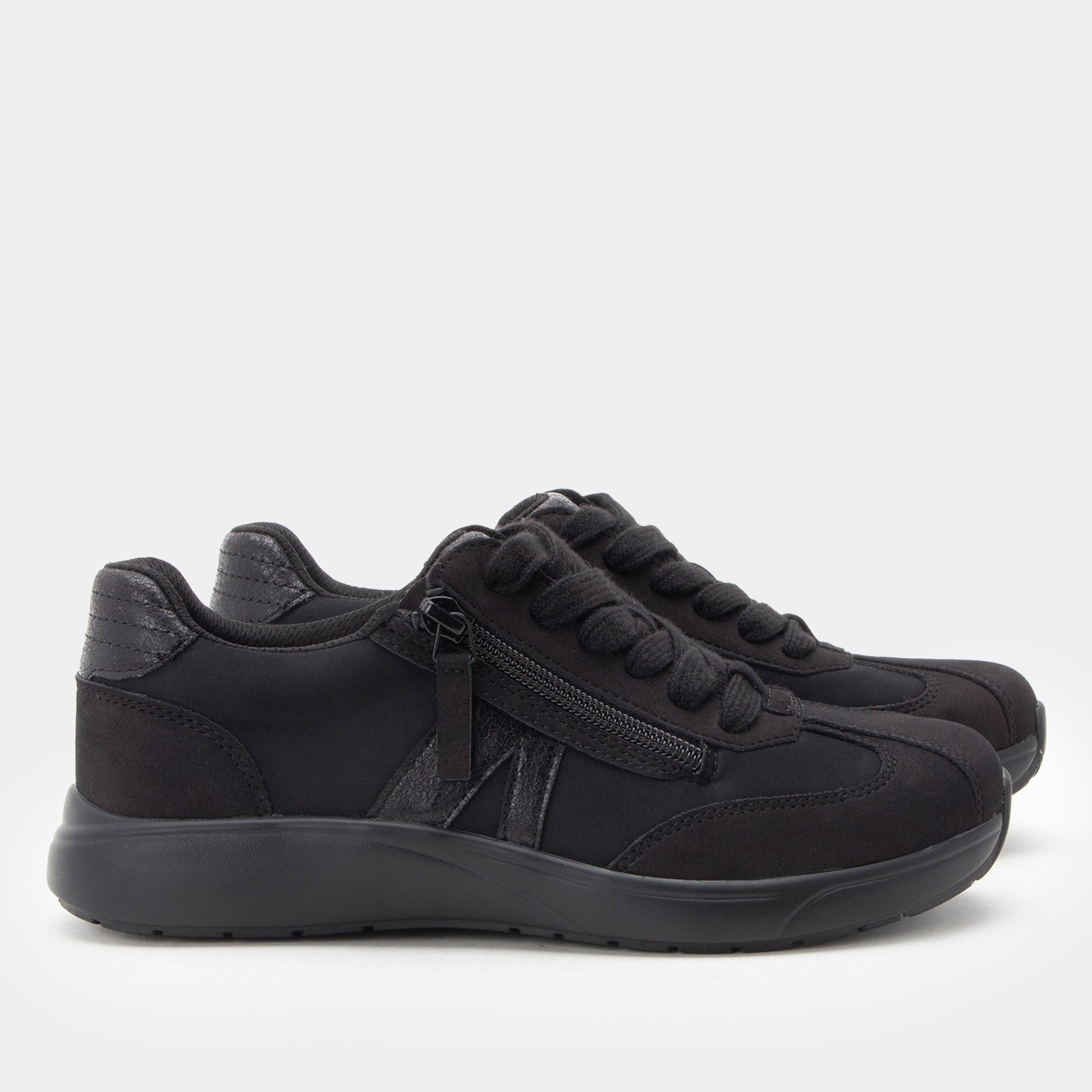 Black sneakers with a zipper on a white background