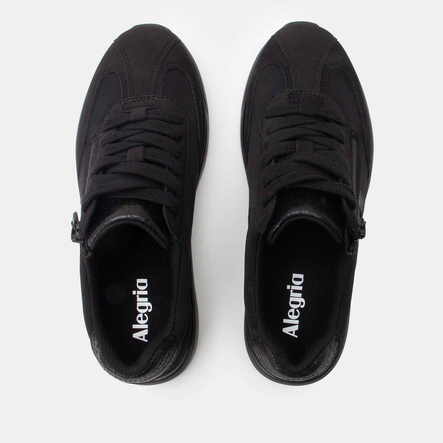 Pair of black Alegria shoes on a white background