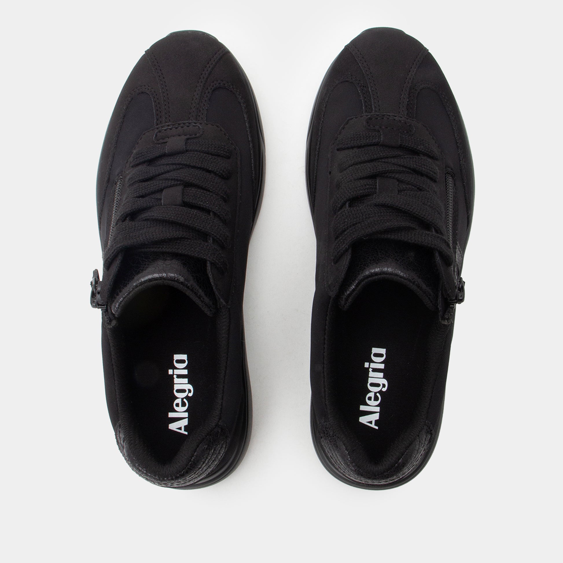 Pair of black Alegria shoes on a white background