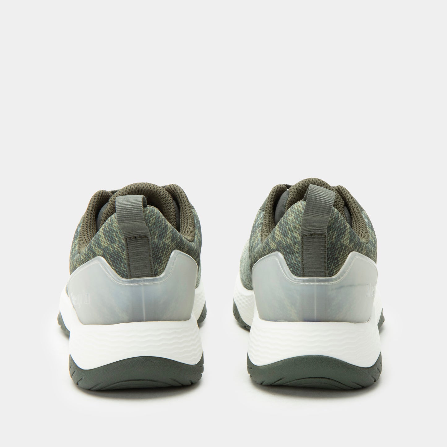 Pair of gray and white sneakers on a light gray background