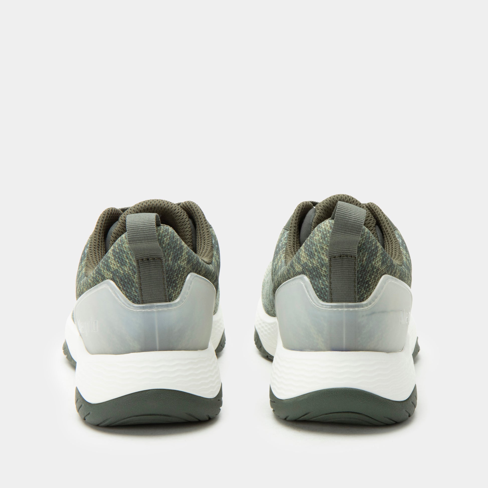 Pair of gray and white sneakers on a light gray background