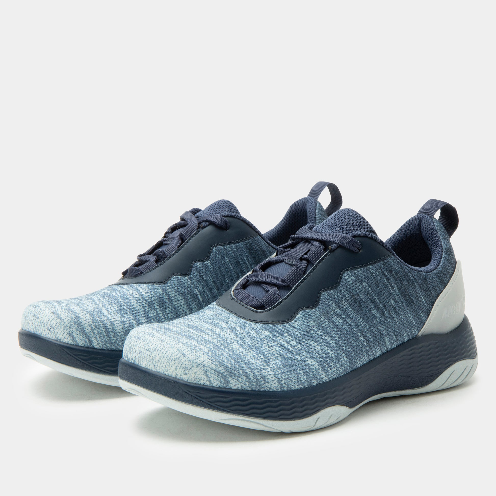 Pair of blue athletic shoes on a light gray background