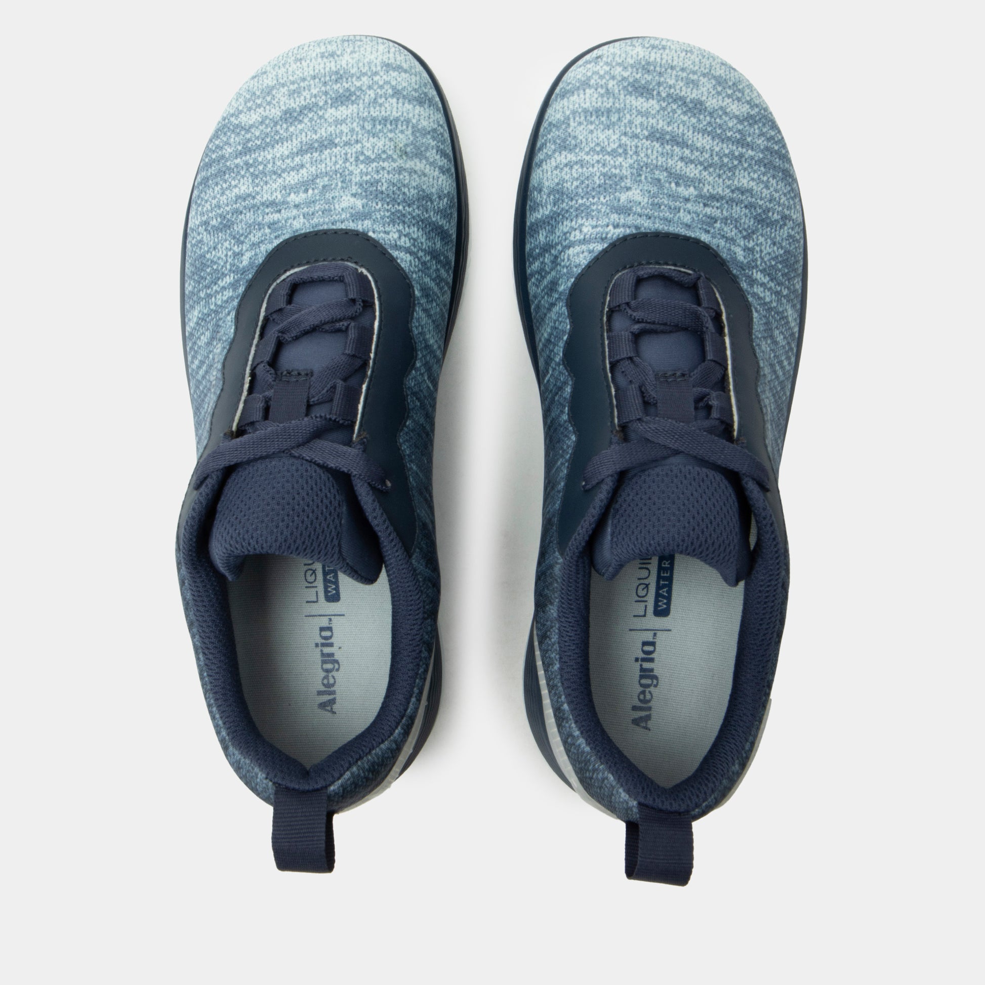 Pair of blue athletic shoes on a light gray background